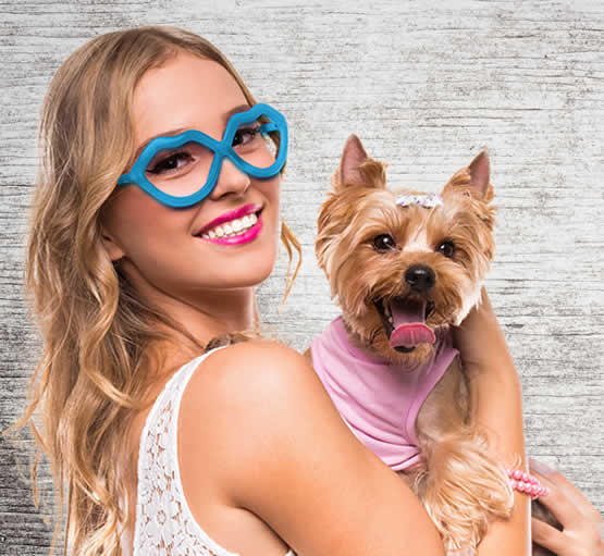 Girl Smiling With Small Dog